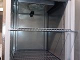 a refrigerator with a door open in a room
