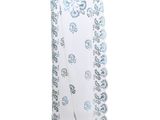 the white and blue floral dress is hanging on a clothes rack
