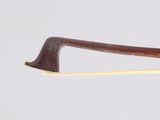 an image of a bow with a wooden handle on a white background