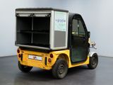 a small cart with a shelf on the back of it