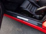 an image of a red sports car with its door open