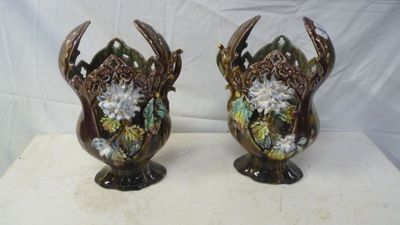 two vases that are sitting on a table