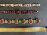a lot of different bracelets and bracelets that are on a table