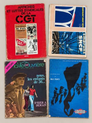 several books are stacked on top of each other on a table