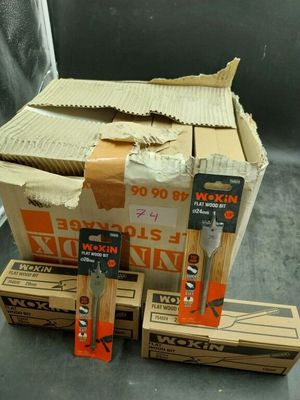 boxes of tools are stacked on top of each other on a table