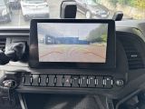 a picture of a car dashboard with a monitor on it