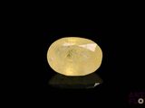 a yellow diamond on a black surface