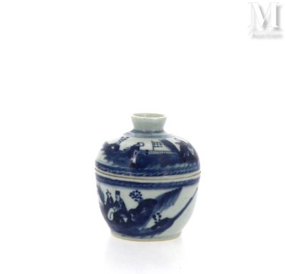 un petit vase bleu et blanc orné d'un motif représentant un oiseau