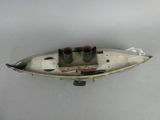 a small toy boat that is sitting on a table