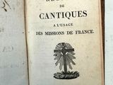 un vieux livre sur lequel figure l'image d'un moulin à vent