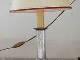 a lamp that is sitting on a table with a lamp shade on it