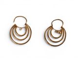 a pair of gold hoop earrings on a white background