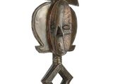 an image of a sculpture of a helmet on top of a wooden base