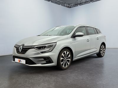 a white car in a white room with a black floor