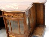 a wooden desk with a glass door and a drawer