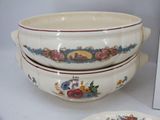 three bowls and a plate sitting on a table