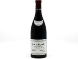 bottle of red wine sitting on a white surface with a white background