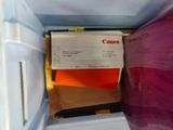 folders in a freezer with a notepad in it
