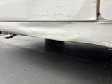 a close up of a car ' s rear end with a flat tire