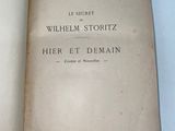 an open book with a handwritten title on it sitting on top of a table