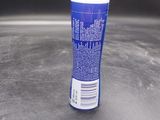 a close up of a bottle of deodorant on a table