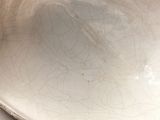 a white bowl sitting on top of a white table