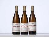 three bottles of wine sitting on top of a table next to each other