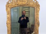a man taking a picture of himself in a mirror