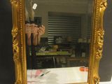 a person taking a picture of themselves in a mirror