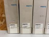 three boxes of festo are stacked on top of each other on a table