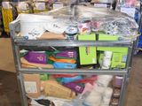a metal cart with many items on it in a warehouse