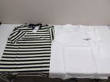 two shirts are sitting on a table next to each other