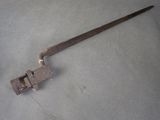 an old tool that is laying on the floor