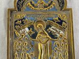 a gold and blue plaque with a picture of a woman holding a child