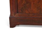 a small wooden cabinet with a clock on top of it