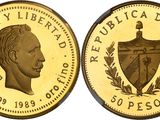 a close up of a gold coin with a picture of a man on it