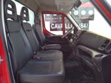 a red truck with black seats in the back of it