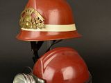 fireman ' s helmet with a torch in it on a black background