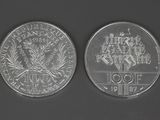 two silver coins with a picture of a man on the front and a picture of a woman on the back