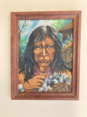 painting of a native woman holding a kitten in her arms