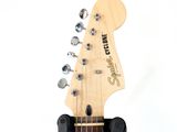 a close up of an electric guitar with a white background