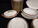 many plates and bowls that are sitting on a table