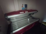 a tanning bed in the corner of a room