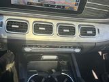 the dashboard of a car with a gps device in the center