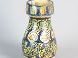 a small vase that is sitting on a table