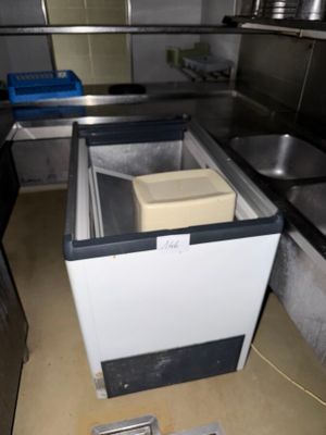 an image of a kitchen with a sink and a freezer