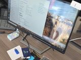 an image of a desk with a computer monitor and keyboard