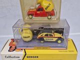 three toy cars are stacked on top of each other in a box
