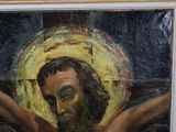 a painting of a man with a cross on a wall