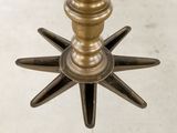 a metal candle holder with a star design on it